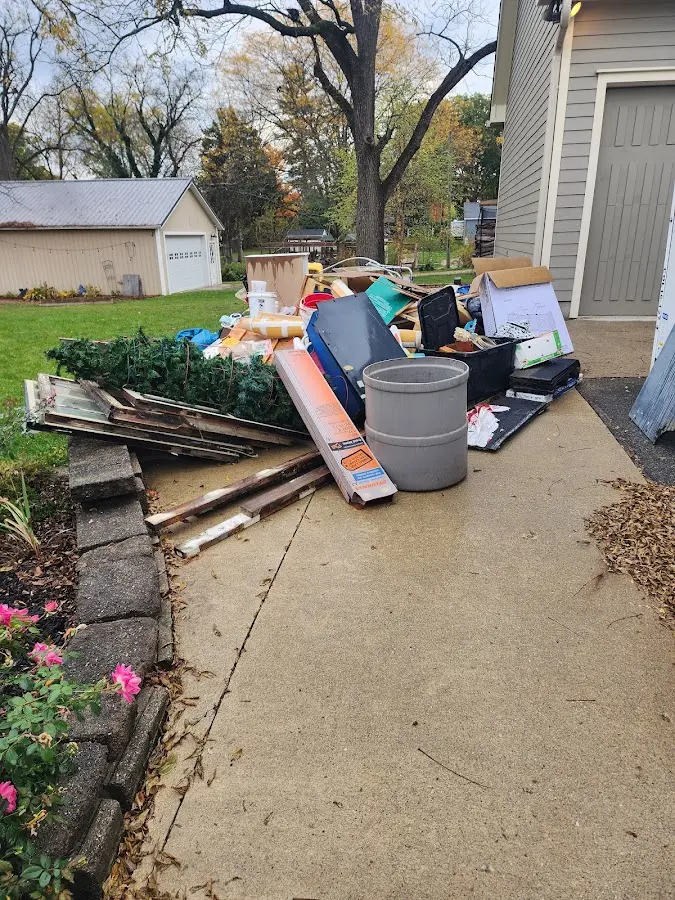 Dumpster being loaded with debris for Commercial Dumpster Rental in Pleasantville